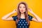 Portrait of sexy, nice, lovely, pretty, adorable woman in polka-dot outfit holding hands on hat with close eyes, blowing air kiss