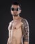 Portrait of Shirtless Tattooed Man