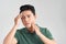 Portrait of shirtless young handsome Asian man checking his face for skin care and beauty concepts, studio shot isolated on white