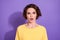 Portrait of shocked disappointed girl stare in camera wear bright sweatshirt  over violet color background