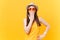 Portrait of shocked fun crazy young woman in straw summer hat, orange glasses cover mouth hand, copy space isolated on