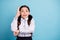 Portrait of shocked surprised child pigtails raise hands want answer test exam wear white blouse isolated over blue