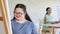 Portrait shot of Asian happy lovely mother standing smiling with young chubby down syndrome autistic autism little daughter