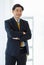 Portrait shot of Asian senior friendly successful reliable business management officer businessman in black formal suit standing