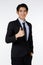 Portrait shot of Asian young happy confident white collar businessman in black stylish modern formal suit standing smiling look at