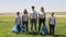 Portrait shot of caucasian happy responsible family standing outdoors with plastic bottle litter bags Spbi.