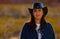 Portrait shot of a cowgirl in the desert at sunset