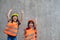 Portrait of sibling girl with a construction hat