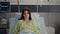 Portrait of sick woman wearing nasal oxygen tube resting in bed