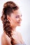 portrait sideview of blonde girl in elegant whimsical coiffure