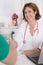 Portrait of sitting brunette physician in uniform hand shaking.