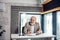 Portrait of sitting pleasant bearded grey-headed old man