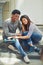 Portrait, skateboard and friends relaxing in the city while bonding with happiness for fun. Skater, man and woman with