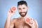 Portrait, skincare and grapefruit with a man model in studio on a blue background for natural beauty or hygiene. Fruit
