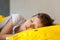 Portrait Sleeping child on soft light background. Little boy sleeping in yellow bed