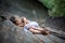 Portrait of sleeping little girl in forest