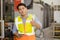 Portrait smart Asian adult professional engineer worker in factory industry CNC operator standing confident thumbs up with safety