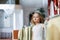 Portrait of smart little girl posing in restaurant