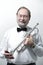 Portrait.smiling adult man musician with a trumpet