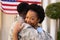 Portrait of smiling african american hugging military soldier on his return home