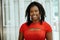 portrait of smiling african american wearing red top