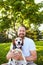 Portrait of smiling bearded man with his dog