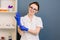 Portrait of smiling beautiful woman doctor wearing gloves. medical employee. Cosmetologist before anti ageing procedure