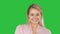 Portrait of a smiling blond woman on a Green Screen, Chroma Key.