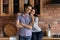 Portrait of smiling bonding millennial hispanic couple posing in kitchen.