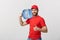 Portrait smiling bottled water delivery courier in red t-shirt and cap carrying tank of fresh drink and showing thumb up