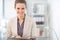 Portrait of smiling business woman with documents