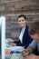 Portrait of smiling businessman working on personal computer