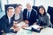 Portrait of smiling businesspeople in conference room