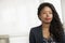 Portrait of smiling businesswoman with dreadlocks, head and shoulders