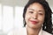 Portrait of smiling businesswoman with dreadlocks, head and shoulders