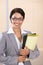 Portrait of a smiling businesswoman holding folder