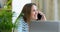 Portrait of smiling businesswoman talking mobile phone in office