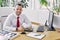 Portrait of smiling car dealer at table