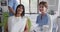 Portrait of smiling caucasian female dental nurse with female patient at modern dental clinic