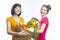 Portrait of Smiling Caucasian Girlfriends Holding Shopping Bags Full of Vegetables