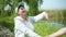 Portrait of a smiling cheerful elderly woman who is engaged in physical gymnastics and breathes fresh air hold hands