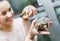 Portrait of smiling cheerful woman holding turtles