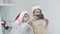 Portrait of smiling children making selfie in santa hats near christmas tree.