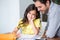 Portrait of smiling daughter with father at desk