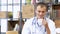 portrait of smiling doctor having a coffee break in the staff room