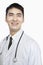 Portrait of Smiling Doctor with Stethoscope Around Neck, Studio Shot, Looking Up