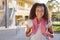 Portrait of smiling elementary school girl with her backpack