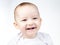 Portrait of smiling eleven-month-old baby on a white background