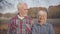 Portrait of smiling European senior couple looking at camera and at each other. Mature Caucasian family standing in