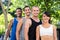 Portrait of smiling extreme athletes standing in a row